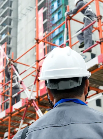 Person on Construction Site with Impact Detect Integrated into Construction Helmet